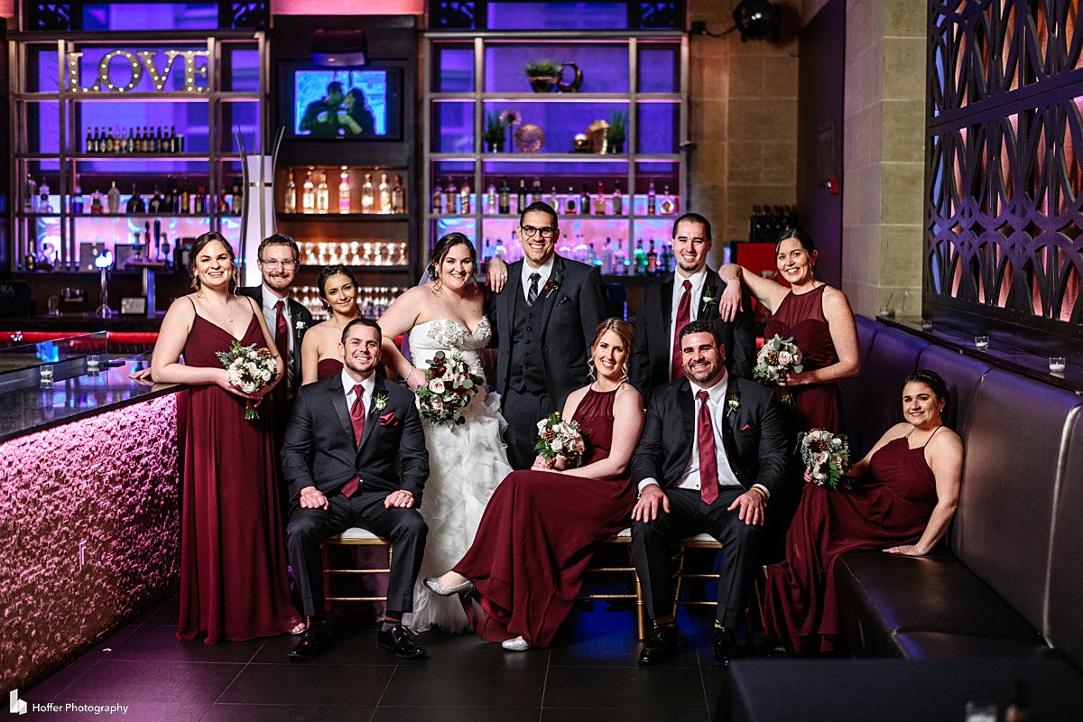 Bridal party portrait next to bar area at Union Trust in Philadelphia